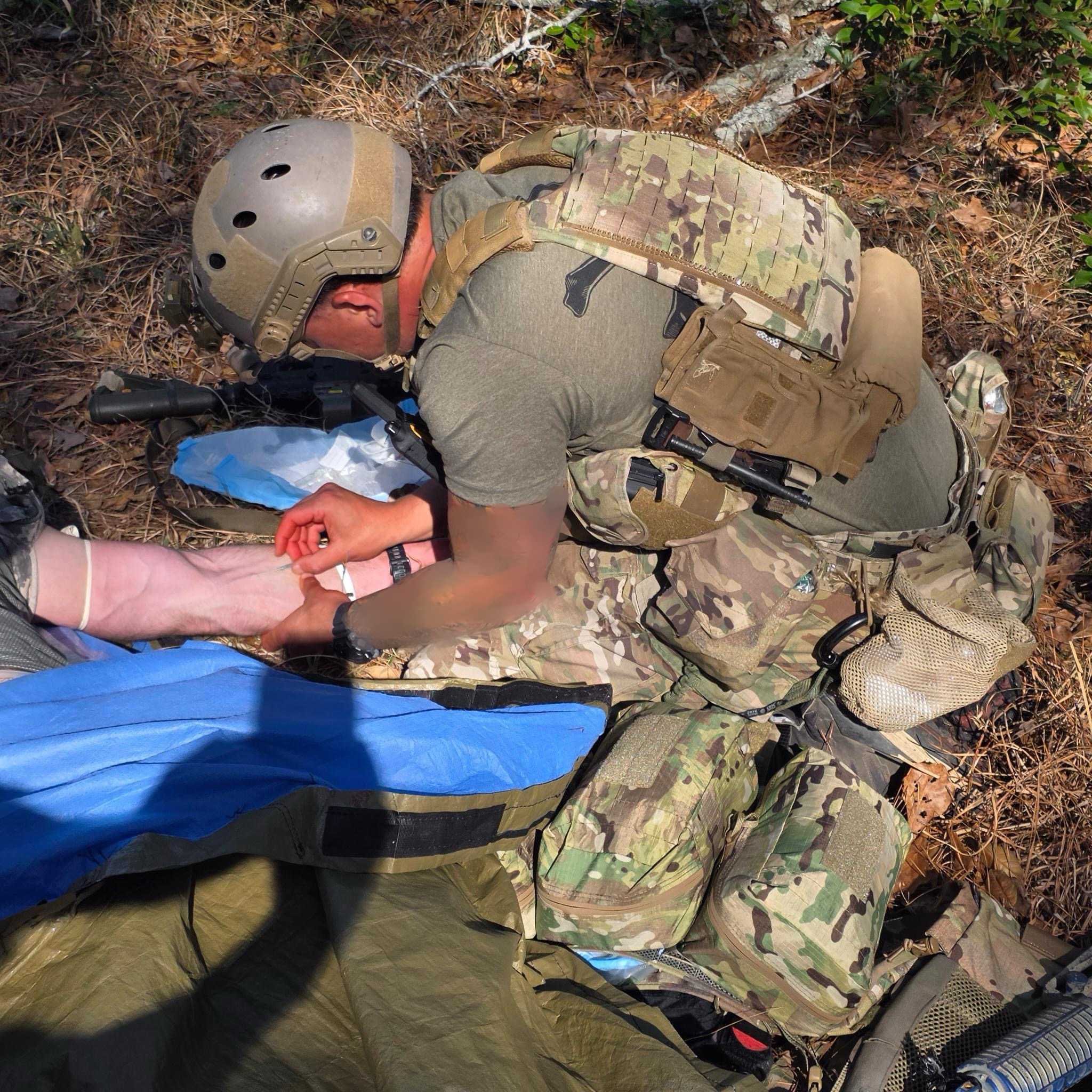 Military medic treating a casualty